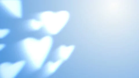 Bokeh in the shape of a heart on a blue background animated background  Video stock 169434181