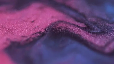 Bokeh sparkles fluid spill pink blue wave flow Stock Footage 287941653