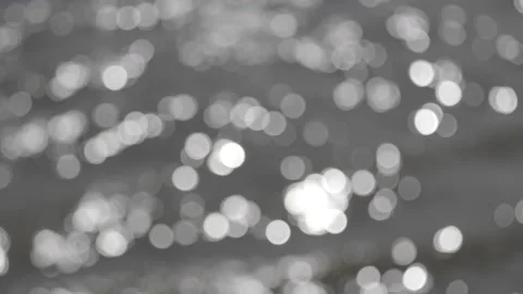 Bokeh sun glare reflected in water surface Stock Footage 137900489