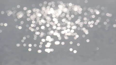 Bokeh sun glare reflected in water surface. Stock Footage 158826474