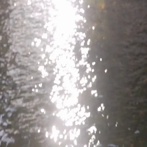 Bokeh of Sun Glares Reflected on Water Stock Footage 69494853