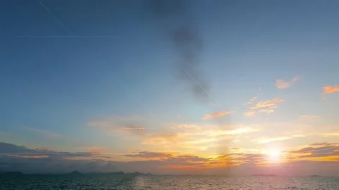 Bokeh sun light ray n sunbeam lens flare on golden sunset blue sky Stock Footage 161221778
