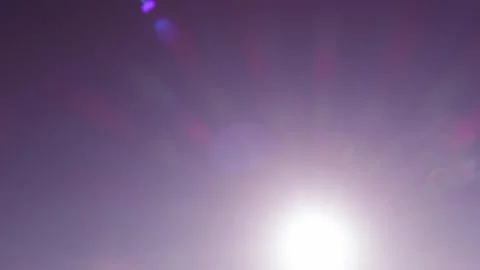 Bokeh sun light ray n bright sunbeam lens flare on red purple sky Stock Footage 161634557