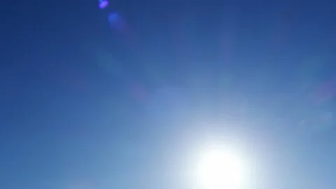 Bokeh sun light ray n bright sunbeam lens flare on dark blue sky Stock Footage 161634571