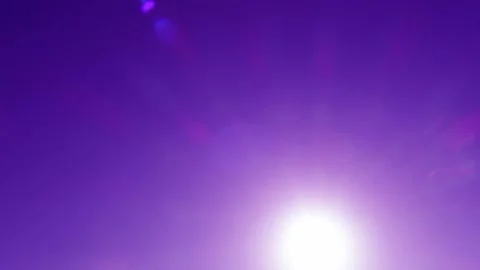 Bokeh sun light ray n bright sunbeam lens flare on magenta blue sky Video stock 161634573