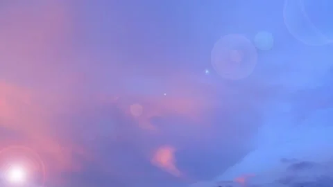 Bokeh sun light ray n lens flare on sunset blue sky n colorful pastel pink cloud Stock Footage 204963388