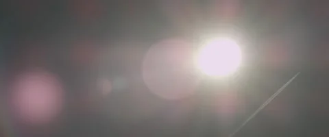 Bokeh Sun Spots with Plane Stock Footage 140259297