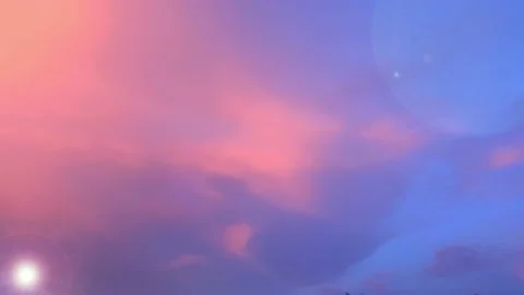 Bokeh sunl light ray n lens flare on Pastel pink cloud n sunset blue sky Stock Footage 204963373