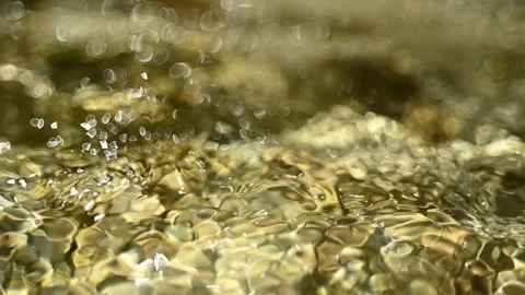 Bokeh of sunlight effects on a mountain river (slow motion) Stock-Footage 211747376