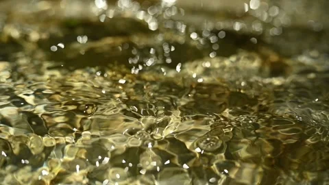 Bokeh of sunlight effects on a mountain river (slow motion) Stock Footage 211747437