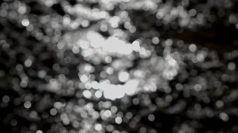 Bokeh of sunlight sparkling on a flowing river Stock Footage 280379151