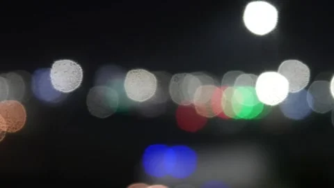 Bokeh traffic lights blur at night Stock Footage 321978876