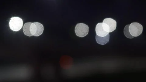 Bokeh traffic lights blur at night Stock Footage 321978880