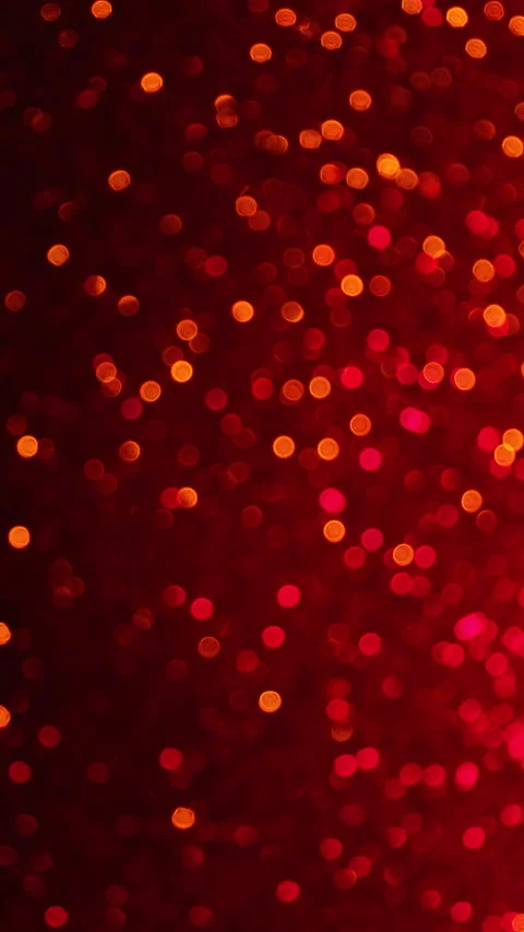 Bokeh vertical background of vibrant ruby red and gold colors. Fast changing Stock Footage 168494580