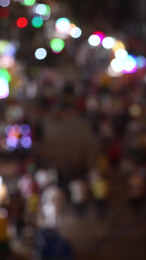 Bokeh view of blurred traffic lights on Main Bazaar street. Vertical video. Stock Footage 285434858