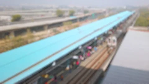 Bokeh view of metro train arriving at metro station in New Delhi, India. Stock Footage 310035828