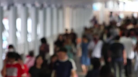Bokeh view of passengers and blurred lights at Chong Nonsi BTS skytrain station Stock Footage 278374556