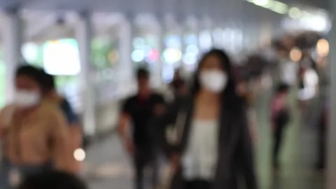 Bokeh view of passengers and blurred lights at Chong Nonsi BTS skytrain station Stock Footage 278374565