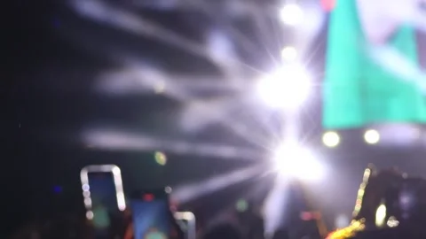 Bokeh view of people dancing on the dance floor during a concert at a festival. Stock Footage 312122889
