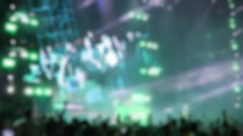 Bokeh view of people dancing on the dance floor during a concert at a festival. Stock Footage 312135998