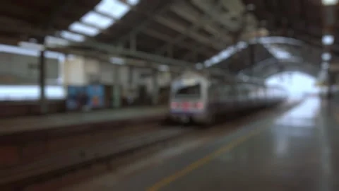 Bokeh view of train is arriving at the metro station in New Delhi, India. Stock Footage 306501388