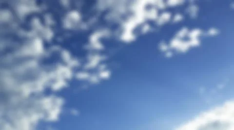 Bokeh white clouds, blue sky, the azure stratosphere, and spindrift. Stock Photos