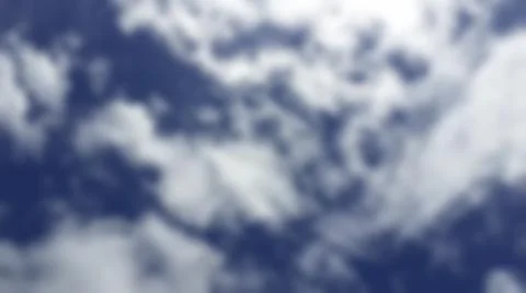 Bokeh white clouds, blue sky, the azure stratosphere, and spindrift. Stock Photos