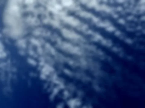 Bokeh white clouds, blue sky, the azure stratosphere, and spindrift. Stock Photos