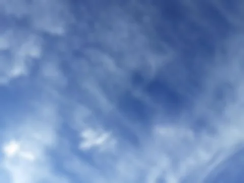 Bokeh white clouds, blue sky, the azure stratosphere, and spindrift. Stock Photos