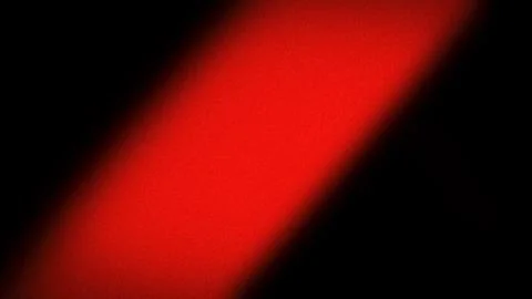Bold 4K red gradient with a grainy texture against a black background. This.. Illustrazione stock