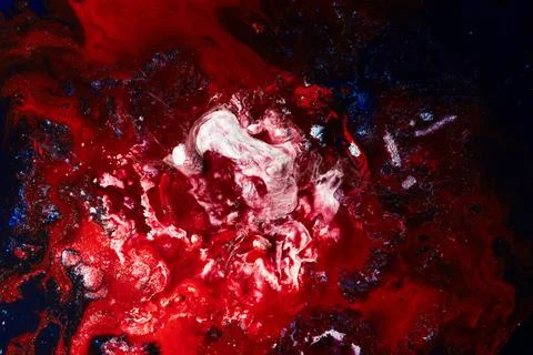 A bold, abstract, fluid background with intense red tones. Red abstract Stock Photos