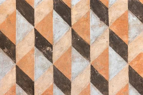 Bold chevron tile pattern in warm earth tones creates a dramatic, classic b.. Stock Photos