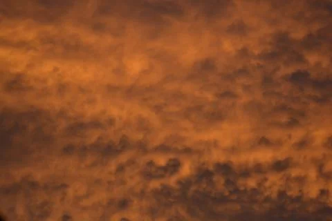 Bold Diagonal Orange Cloud Veins at Sunset Stock Photos