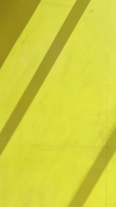 Bold Diagonal Shadows on Mustard Yellow Wall Abstract Background Stock Footage 346281638