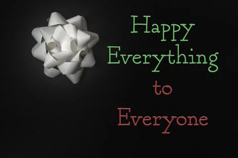 A bold "Happy Everything to Everyone" message stands out on a sleek black Stock Photos