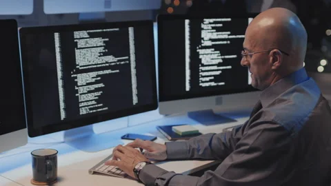 Bold Man Coding in Office at Night Video stock 171059081