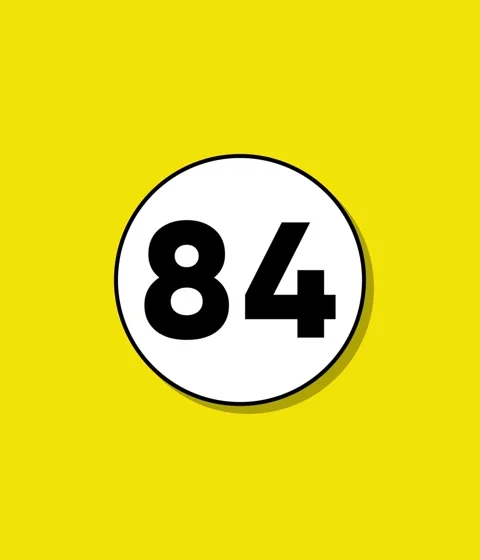 Bold number 84 graphic appears inside white circle on bright yellow backgro.. Stock Footage 332396587