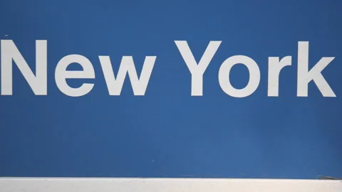 Bold white "New York" text centered on a dark blue background. Stock Footage 327023317