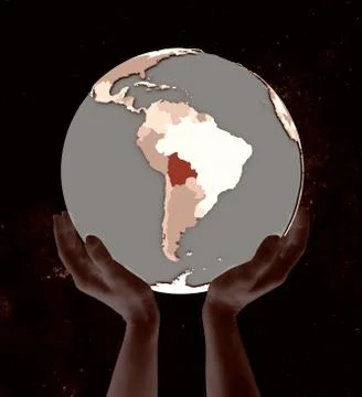 Bolivia on globe in hands Illustrazione stock