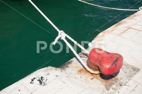 Bollard and mooring ropes Stock Photos