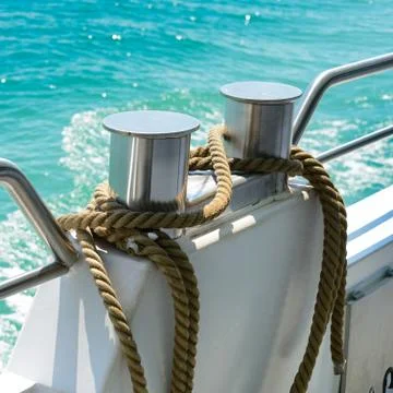Bollard with coiled rope Foto stock