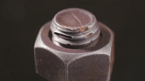 Bolt and nut on a revolving table in close-up Video stock 165991963