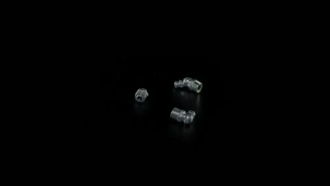 Bolt with nut on a black background close-up. Bolt with nut rotates on a black 動画素材 171162366