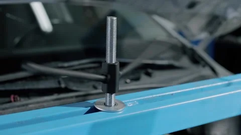 Bolt for reliable fixation of the gearbox in order to repair it in a modern car. Stock Footage 239471527