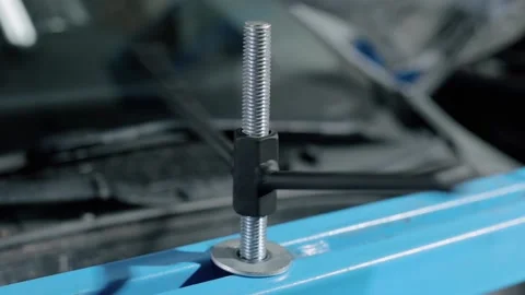 Bolt for reliable fixation of the gearbox in order to repair it in a modern car. Stock Footage 239471752