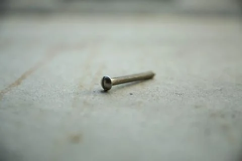 Bolt screw on the ground Stock Photos