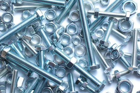 Bolts and nuts of different size Stock Photos