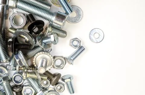 Bolts, nuts and screws. Pattern of nuts and bolts. There is a place for your  Stock Photos