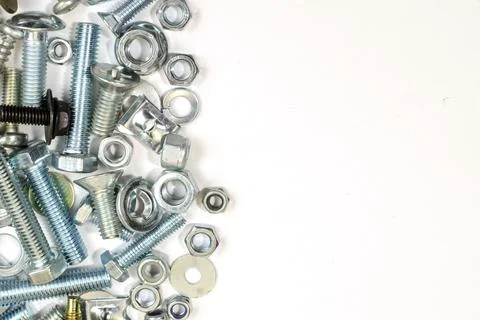 Bolts, nuts and screws. Pattern of nuts and bolts. There is a place for your  Stock Photos