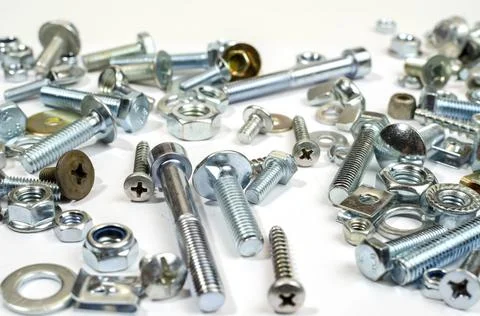 Bolts, nuts and screws. Pattern of nuts and bolts. There is a place for your  Stock Photos